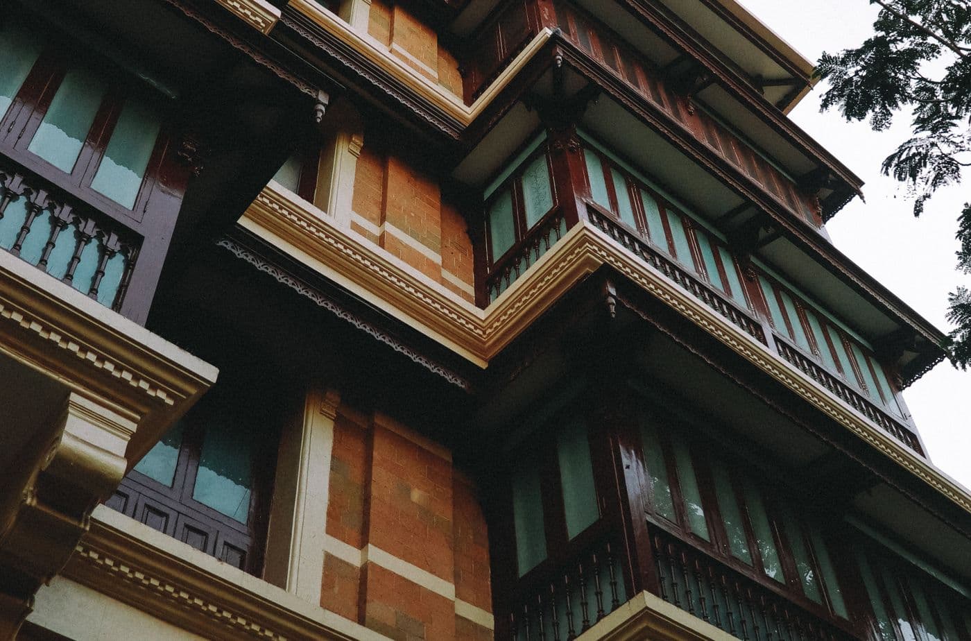 Carved wooden balcony on an old building in the historic Rander area of Surat